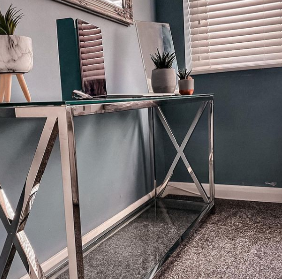 A console table being used as a slim home office desk