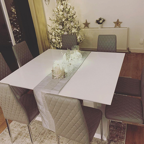 hosting the perfect Christmas - Instagram image of l2 Pivero dining tables pushed togehter with silver table runner over join.