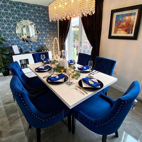The Atlanta dining table used with striking blue dining chairs