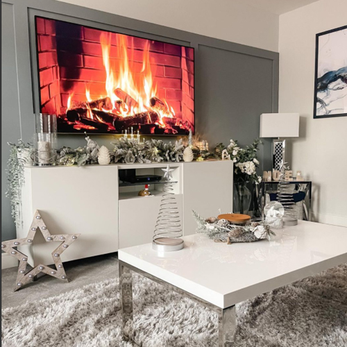 hosting the perfect Christmas - IG image of living room with coffee table and tv stand 