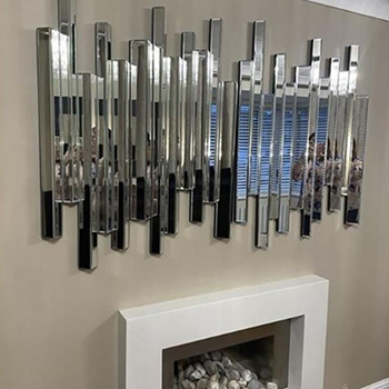 abstract modern mirror ideas - wall above a fireplace with 2x Furniturebox UK Cascina mirrors hung side by side to form long mirror piece. Mirror comprises of long mirrored square tubes, at different heights and lengths, to create a wavy pattern. Reflection is diffuse and soft. 