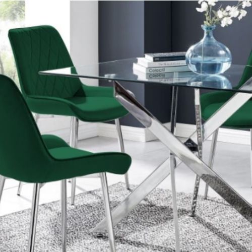 how to choose a dining room colour scheme blog image featruing glass rectangular dining table with chrome nested starbust legs and green velvet dining chairs with silver tapered legs