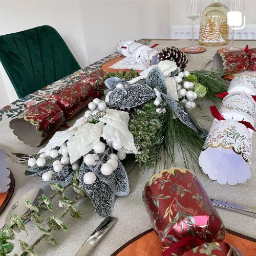 christmas tablescape with green velvet chair in background