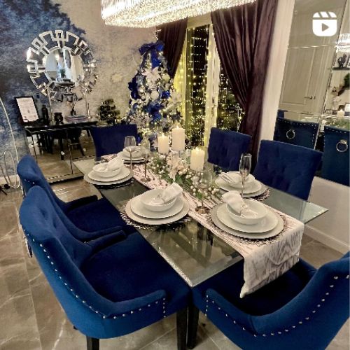 christmas decor inspiration - blue and silver christmas themed dining room with glass table