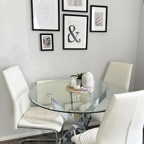 round table, white chairs, white accessories on table