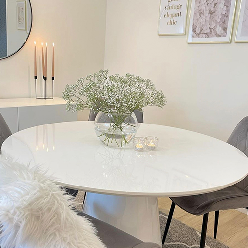 round mushroom table with glass bowl vase filled with white gypsophila / baby's breath flowers