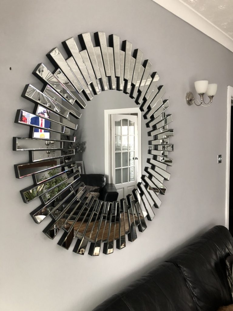 A Starburst mirror being used to reflect light in a room