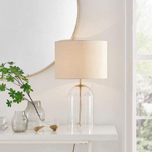 modern table lamp - glass upturned hurricane lamp style clear glass base with cream fabric lampshade