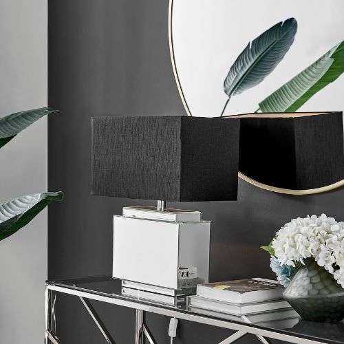 statement lamp with mirrored rectangular base and oversized black rectangular fabric lampshade