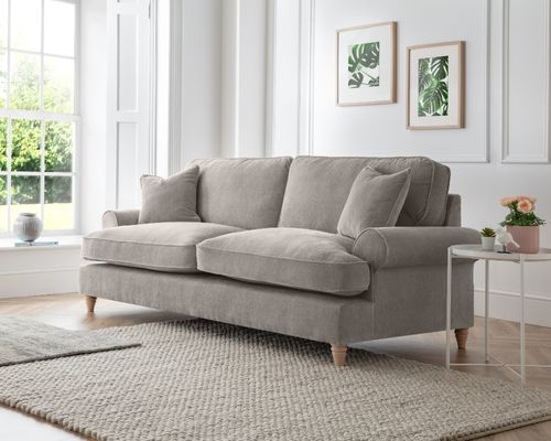 modern 3 seater velvet sofa in outty beige to illustrate how far to place sofa from TV
