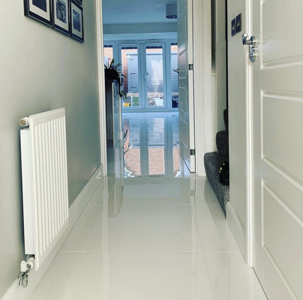 Brand new white tiled flooring used in a hallway