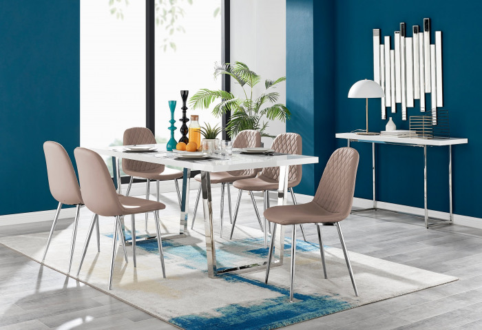 A white high gloss dining table with cappuccino coloured dining chairs in a modern dining room with cobalt blue walls and modern accessories