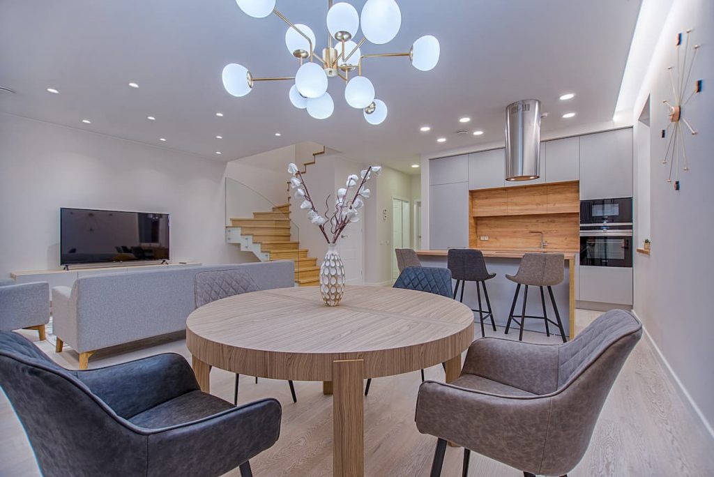 Dining room ceiling lights over a dining table in an open plan kitchen diner