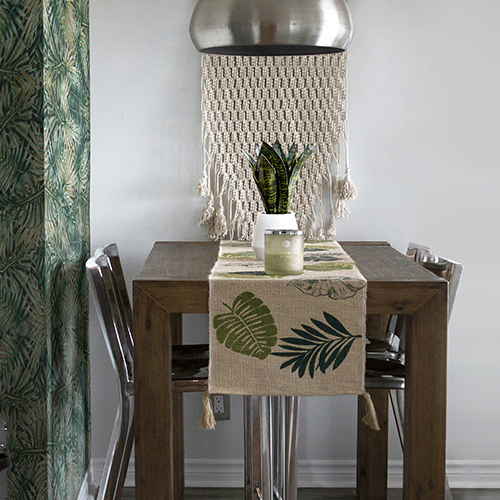 dining table with green leaf print wallpaper