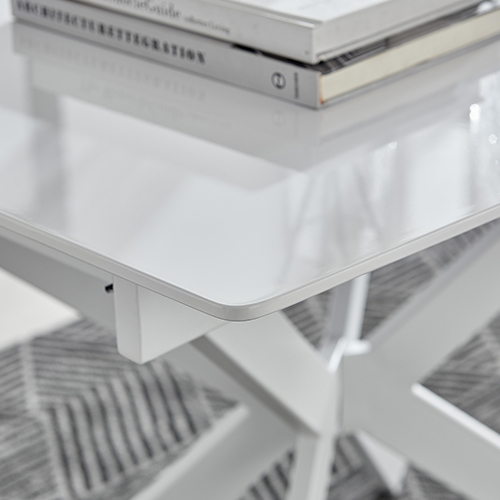 A sleek corner of a white gloss Lira contemporary dining table