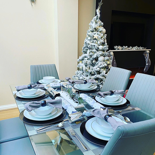 modern dining room with christmas tree