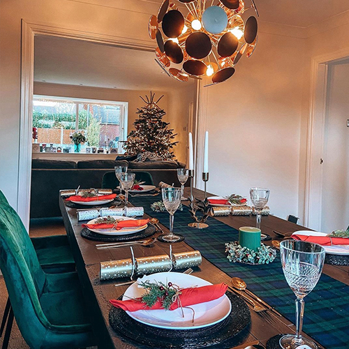 Instagram Christmas inspiration - modern dining area with green tartan table runner and red accents