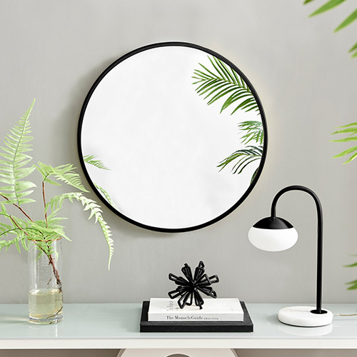 simple minimalist round wall mirrir in black frame.