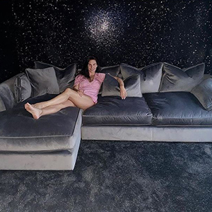 Danielle Lloyd's cinema room featuring a chaise longue sofa in grey