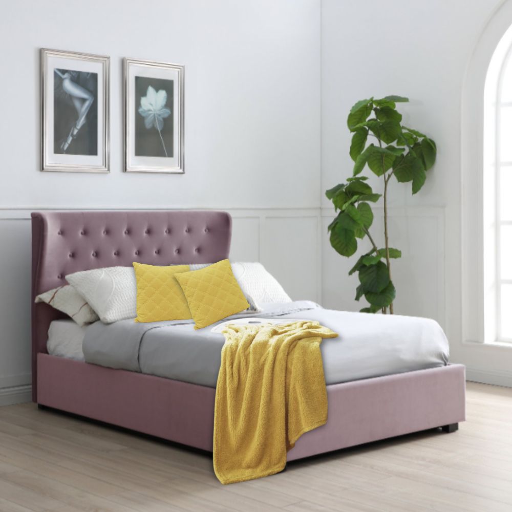 bed styling with pale lilac velvet bed and yellow accessories