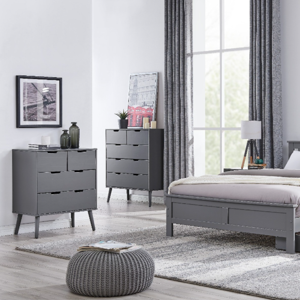 modern grey scandinaian inspired chests of drawers in a bright bedroom. 