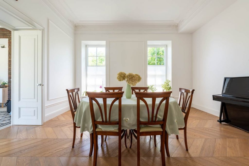 Reupholstered dining chairs around a dining table.