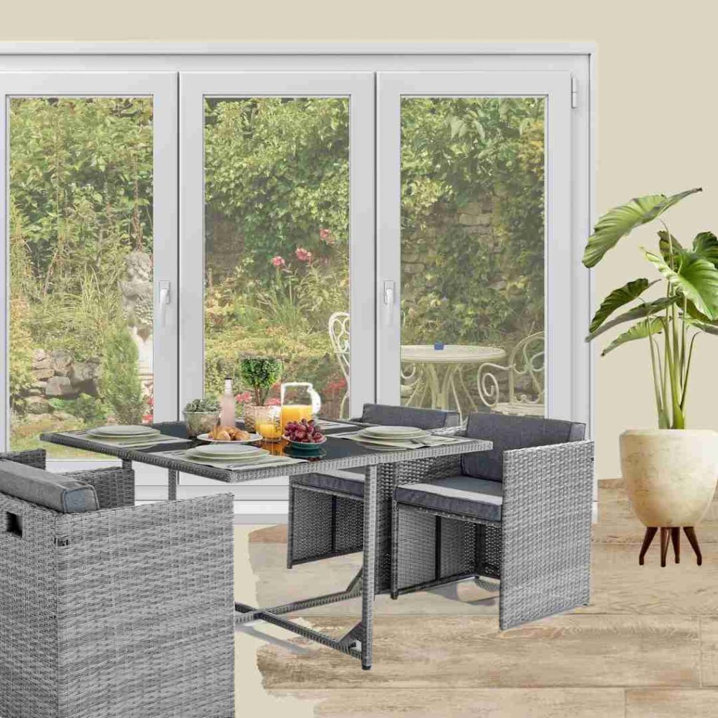 beige grey 4 seater garden furniture set with 4 chairs and glass topped table. In mood board with swatch of yellow tone wood floow, cream plant pot with leafy green plant, wide french patio doors with garden view.