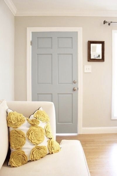 A living room using grey and yellow to balance colour schemes