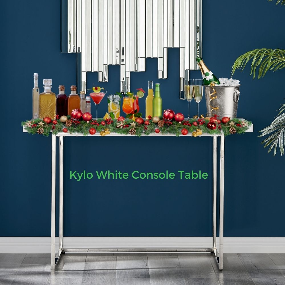 white high gloss rectanguler console table with chrome legs, used as mini cocktail bar.