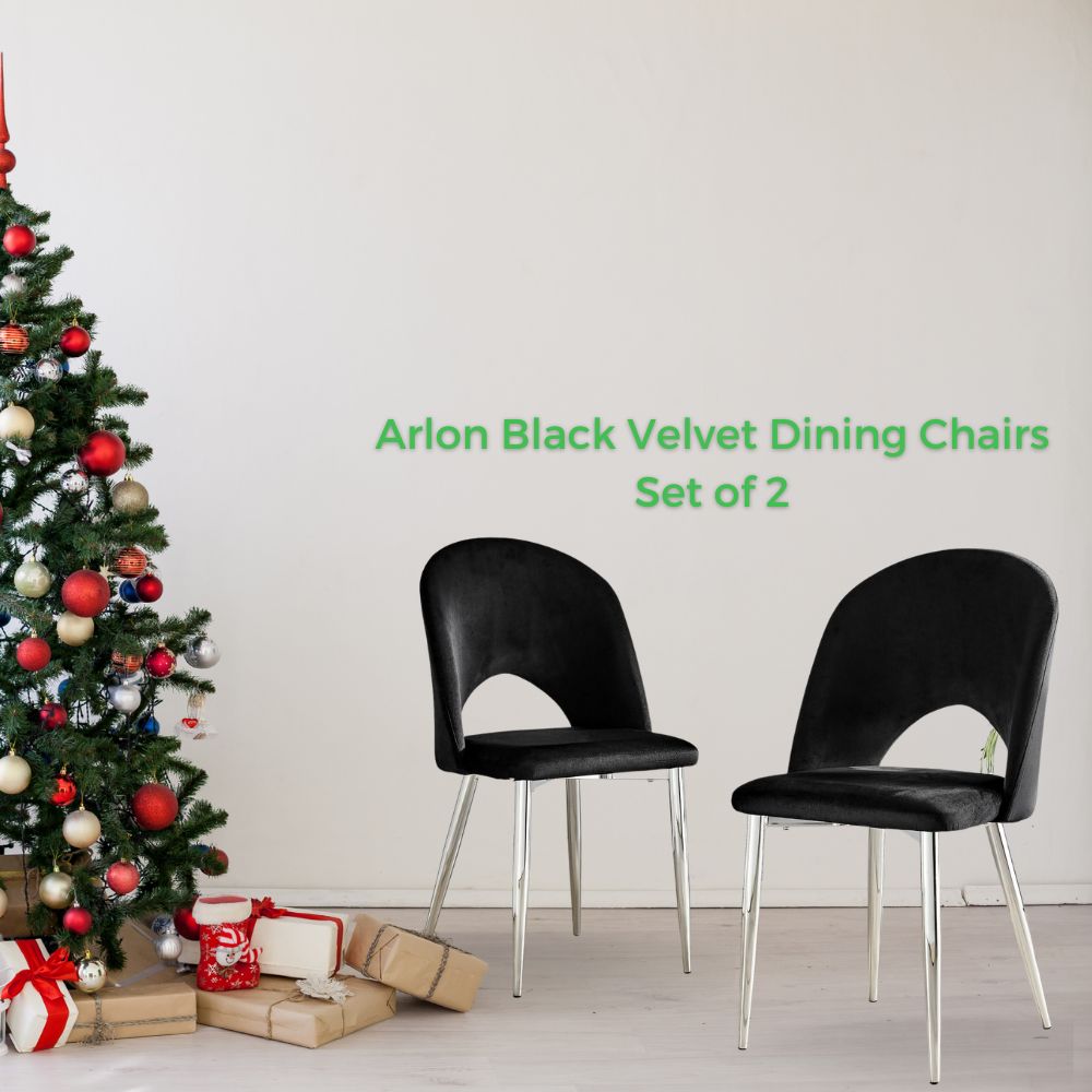 2 black velvet modern dining chairs with silver tapered legs - semi circular cut out to back of chairs