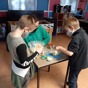 Young members of Seeds4Success baking at a charity fundraiser