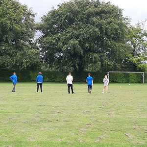 Members of Seeds4Sucess playing football