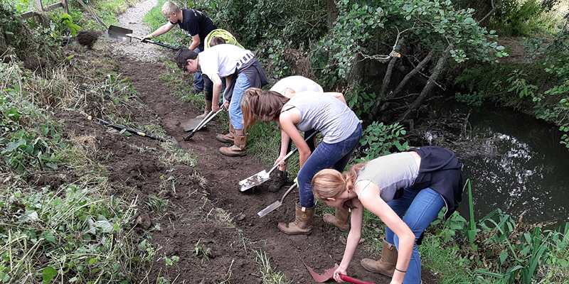 Members of Seeds4Success clearing a footpath