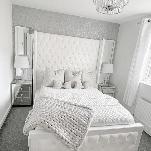 modern white bedroom with bed with tall headboard and 2 mirrored bedside tables from Furniturebox UK