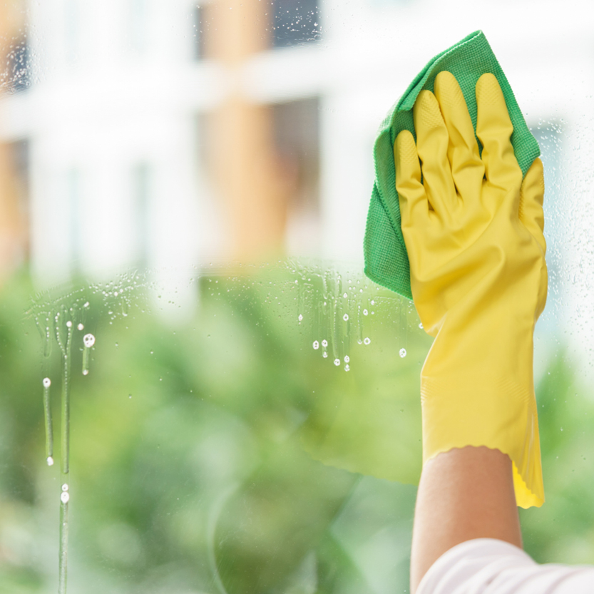 Cleaning a window. clean windows to prepare your home for sale