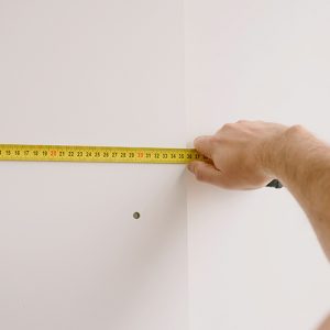 how to measure up for rug buying. Image of tape measure.