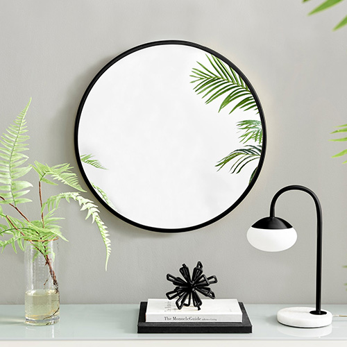 round wall mirror in black frame