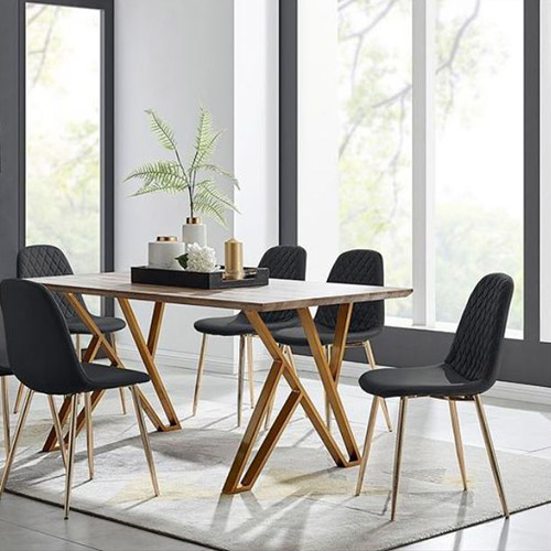 modern wooden trestel style table with gold legs, and 6 black faux leather chair with gold legs to create Scandi dining room look.