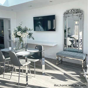 A grey dining set used in a large airy dining room