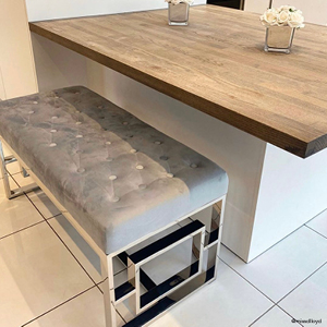 A Cambridge grey velvet bench used on a low dining island