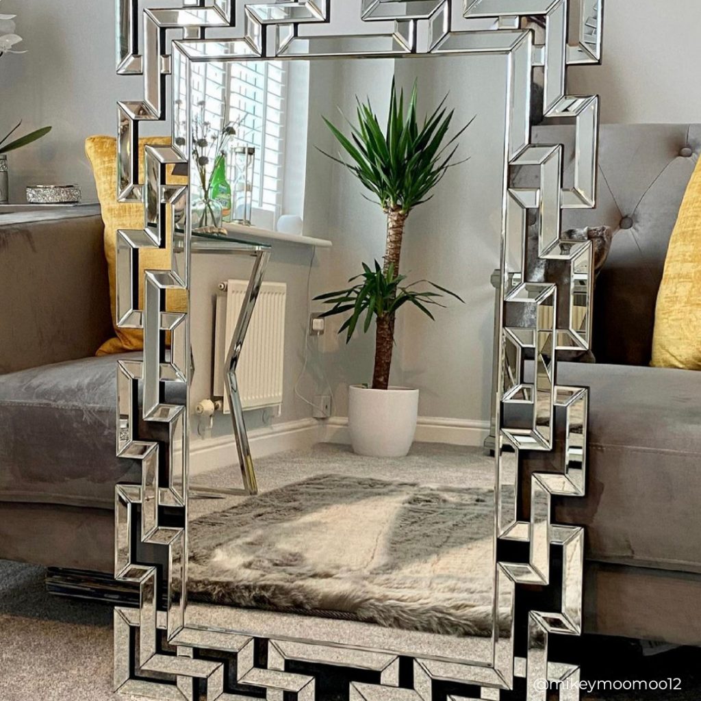unique silver mirror with a border pattern