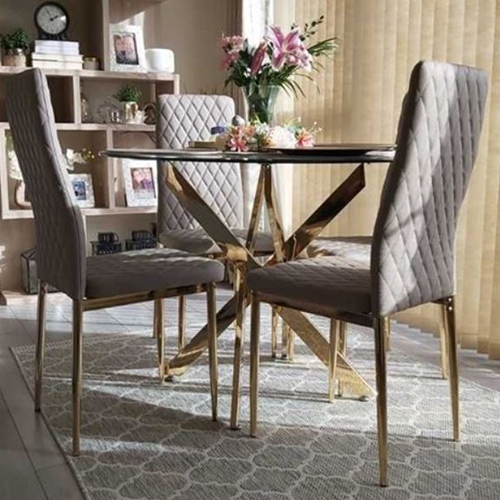 customer photo showing round glass and gold metal dining table with 4 Milan dining chairs with gold legs on the Toscana rug - trellis pattern in cream and grey.