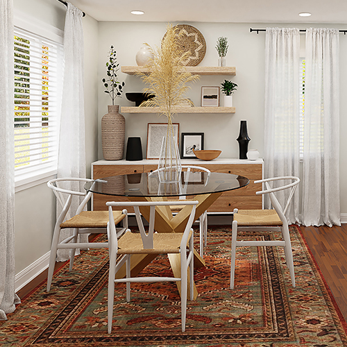 image shows a round glass dining table with wooden legs, and 4 dining chairs, sit on a dark vintage style rug. the floor and rug have warm tones and the wall and other decor are white.