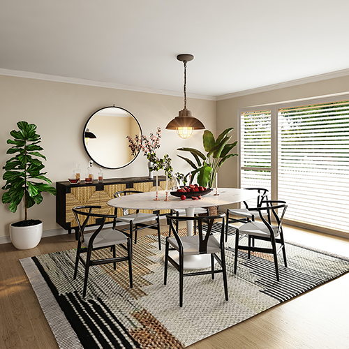 image of a bright dining area, with a patterned rug under a dining table and chairs. The rug matches the neutral tones of the room.