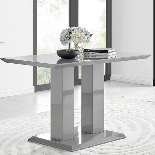 best way to clean high gloss furniture - a grey high gloss dining table with 2 plinth legs.