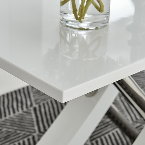 best way to clean high gloss furniture - corner detail of white high gloss dining table wth stainless stell legs