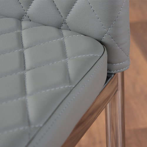 A close up of faux leather dining seat material