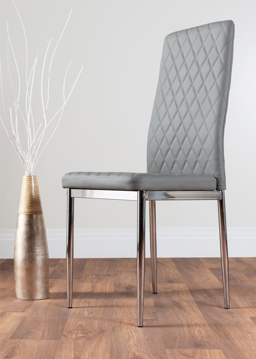 grey faux leather dining chair in a modern dining chair design with chrome legs