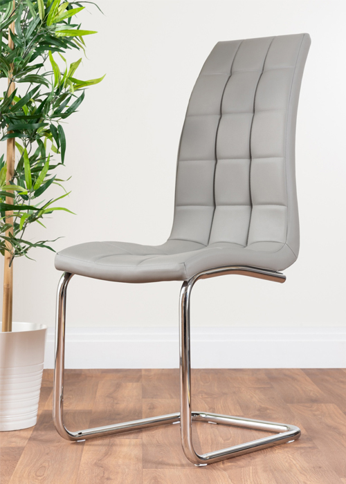 grey faux leather dining chair with modern chrome legs