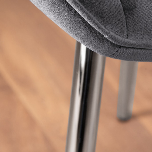 A silver chrome dining chair leg